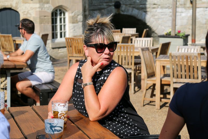lady drinking at Cox's Yard